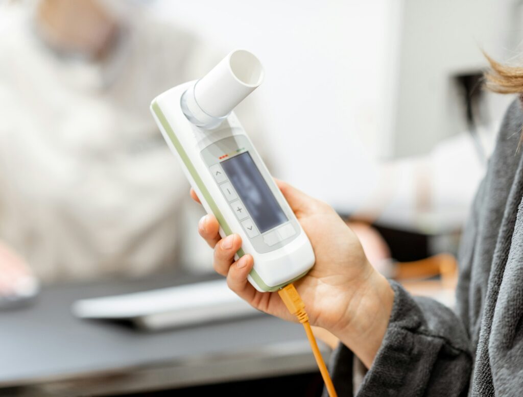 Patient holding spirometer